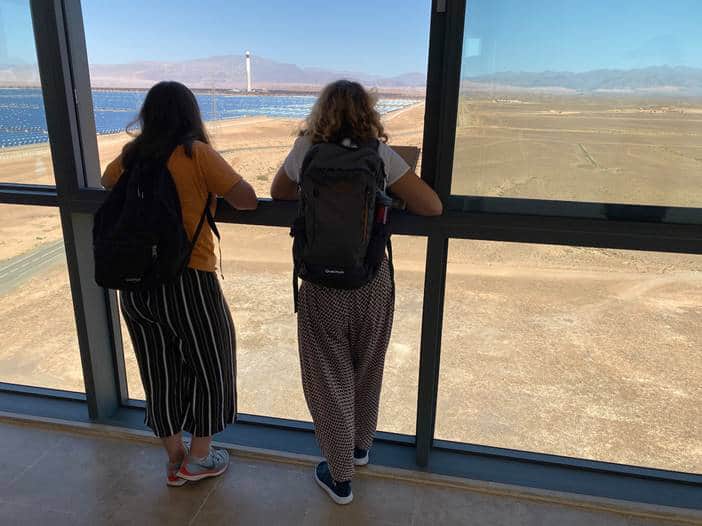 Students from the International School of Geneva - Campus des Nations looking out from the observation tower towards Noor 3