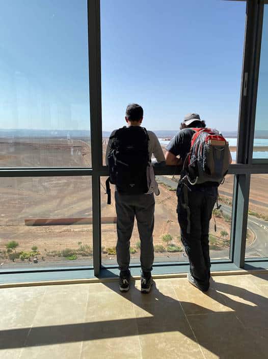 Students from the International School of Geneva - Campus des Nations using the commanding view from the observation tower to look towards Noor 1